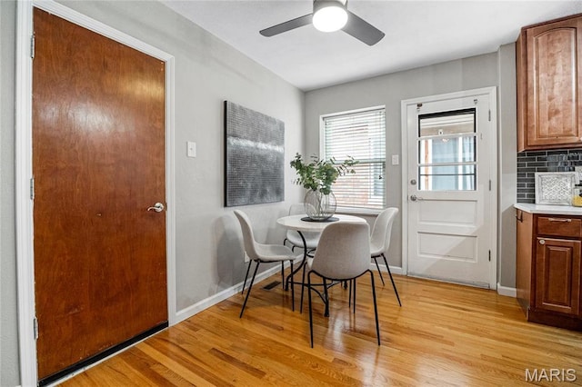 5816 Jamieson Ave, Saint Louis, MO 63109 - dining space featuring light wood finished floors, a ceiling fan, and baseboards