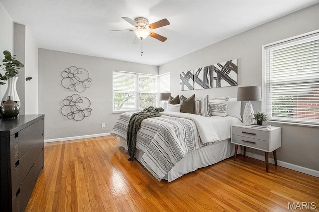 5816 Jamieson Ave, Saint Louis, MO 63109 - bedroom with light wood-style floors, baseboards, and ceiling fan
