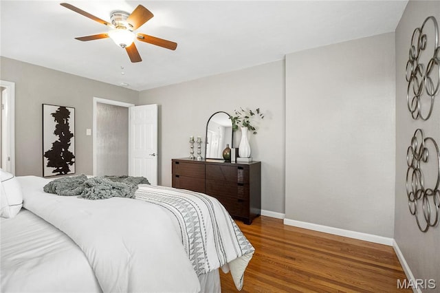 5816 Jamieson Ave, Saint Louis, MO 63109 - bedroom featuring baseboards, wood finished floors, and a ceiling fan