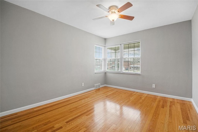 5816 Jamieson Ave, Saint Louis, MO 63109 - unfurnished room featuring ceiling fan, baseboards, and light wood-style floors