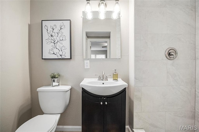 5816 Jamieson Ave, Saint Louis, MO 63109 - bathroom with toilet, vanity, and tiled shower