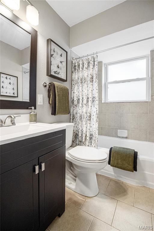 5816 Jamieson Ave, Saint Louis, MO 63109 - bathroom with toilet, vanity, and tile patterned floors