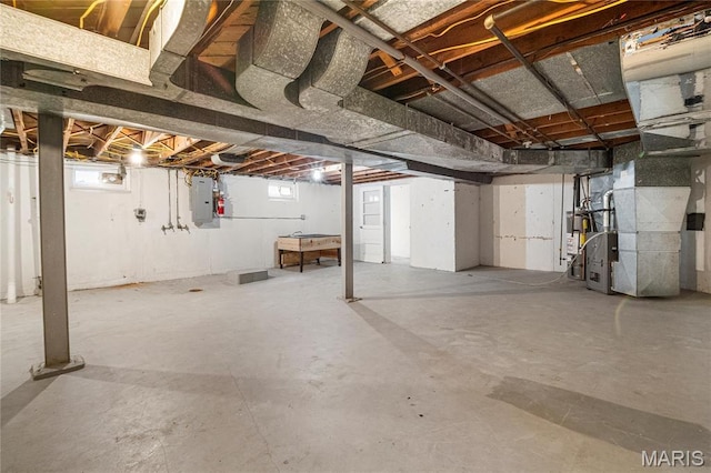 5816 Jamieson Ave, Saint Louis, MO 63109 - below grade area with heating unit, healthy amount of natural light, and electric panel