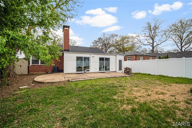 5816 Jamieson Ave, Saint Louis, MO 63109 - back of property featuring a patio area, a chimney, and brick siding