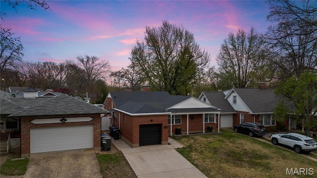 5816 Jamieson Ave, Saint Louis, MO 63109 - ranch-style house featuring an attached garage, driveway, a front lawn, and brick siding