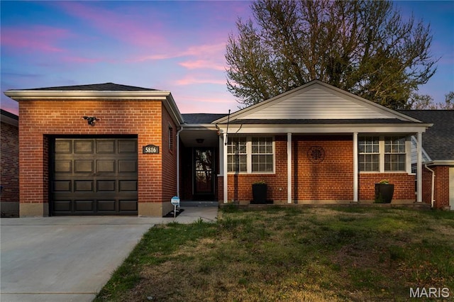 5816 Jamieson Ave, Saint Louis, MO 63109 - single story home with brick siding, a garage, driveway, and a front lawn