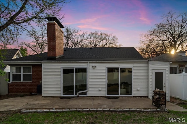5816 Jamieson Ave, Saint Louis, MO 63109 - rear view of house with a patio, a chimney, fence, and a shingled roof