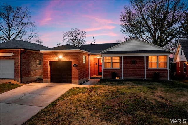 5816 Jamieson Ave, Saint Louis, MO 63109 - ranch-style home with a garage, brick siding, concrete driveway, and a front yard