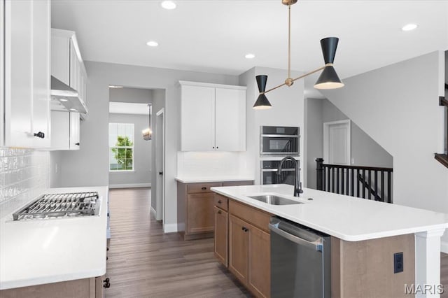 400 Thomlin Ct, Ofallon, MO 63367 - kitchen featuring stainless steel appliances, wood finished floors, tasteful backsplash, light countertops, and recessed lighting