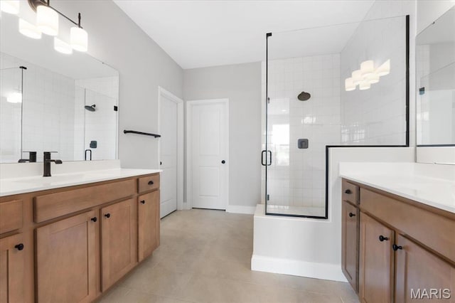 400 Thomlin Ct, Ofallon, MO 63367 - bathroom with a stall shower, two vanities, and tile patterned floors