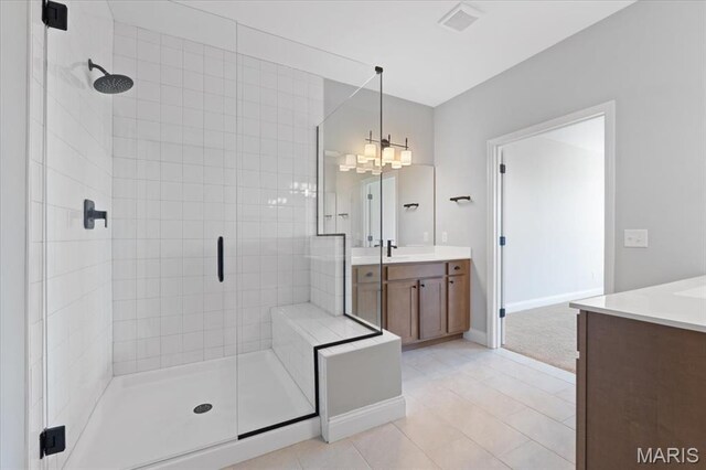 400 Thomlin Ct, Ofallon, MO 63367 - full bathroom with vanity, a stall shower, tile patterned floors, and a chandelier