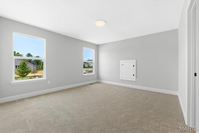400 Thomlin Ct, Ofallon, MO 63367 - unfurnished room with healthy amount of natural light and carpet floors