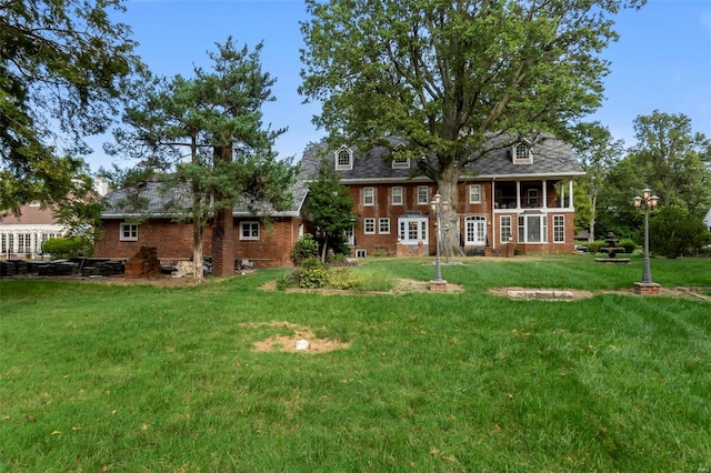 1011 N Ranney St, Sikeston, MO 63801 - back of property with a lawn and brick siding
