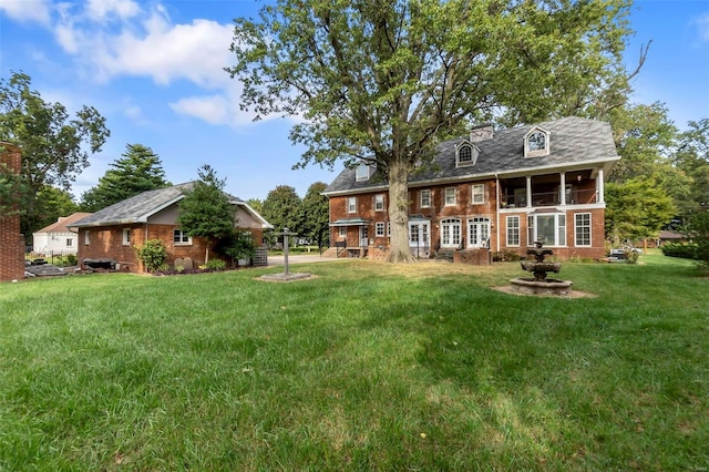 1011 N Ranney St, Sikeston, MO 63801 - back of property with brick siding and a lawn