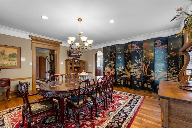 1011 N Ranney St, Sikeston, MO 63801 - dining room with arched walkways, a chandelier, crown molding, wood finished floors, and recessed lighting