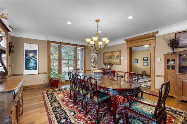 1011 N Ranney St, Sikeston, MO 63801 - dining space with a chandelier, ornamental molding, light wood-style floors, and recessed lighting