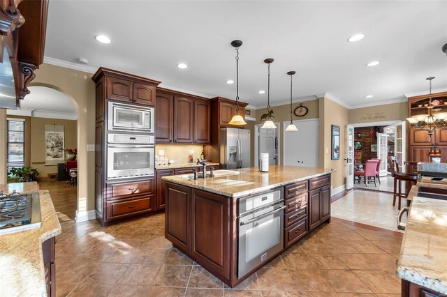 1011 N Ranney St, Sikeston, MO 63801 - kitchen with appliances with stainless steel finishes, baseboards, arched walkways, recessed lighting, and crown molding