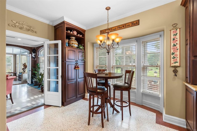 1011 N Ranney St, Sikeston, MO 63801 - dining space featuring a chandelier, plenty of natural light, crown molding, baseboards, and speckled floor
