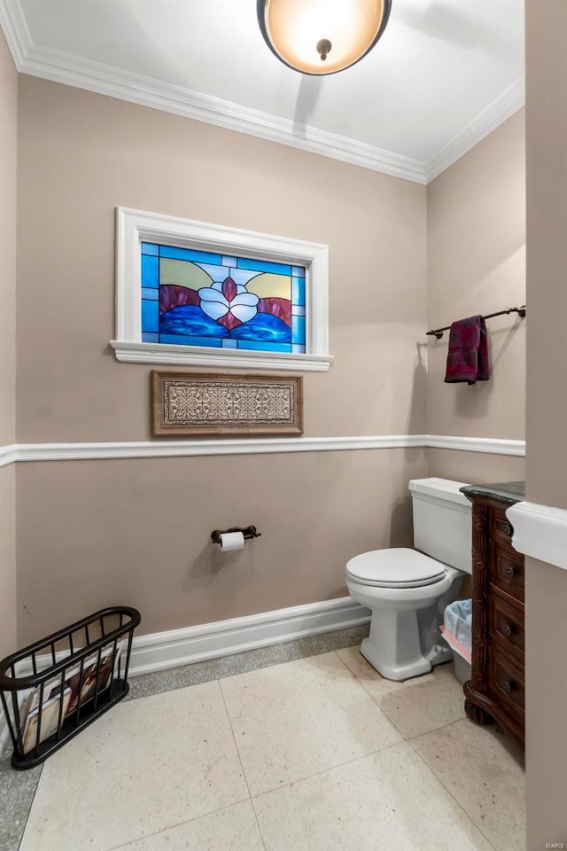 1011 N Ranney St, Sikeston, MO 63801 - half bath with baseboards, crown molding, and toilet