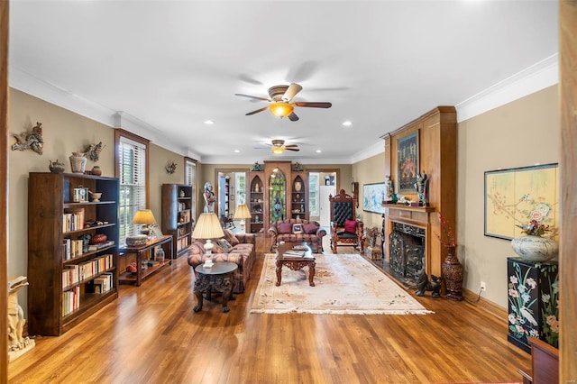 1011 N Ranney St, Sikeston, MO 63801 - living room with a ceiling fan, plenty of natural light, light wood-style flooring, ornamental molding, and recessed lighting