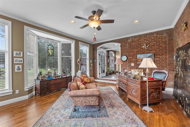 1011 N Ranney St, Sikeston, MO 63801 - home office featuring wood finished floors, baseboards, ceiling fan, crown molding, and brick wall