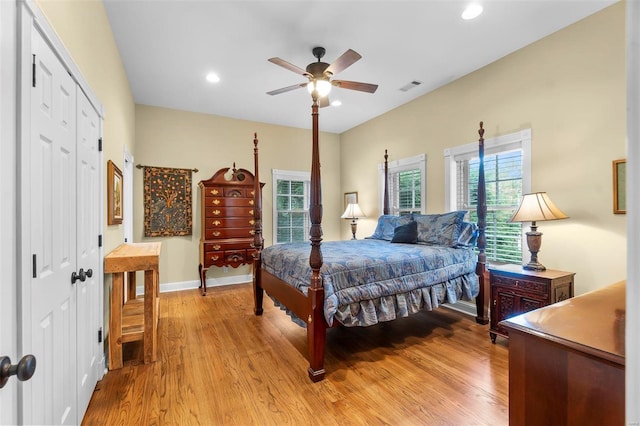 1011 N Ranney St, Sikeston, MO 63801 - bedroom with light wood-style floors, a closet, recessed lighting, baseboards, and ceiling fan