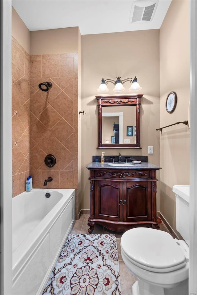 1011 N Ranney St, Sikeston, MO 63801 - bathroom with toilet, shower / bathtub combination, baseboards, vanity, and tile patterned flooring