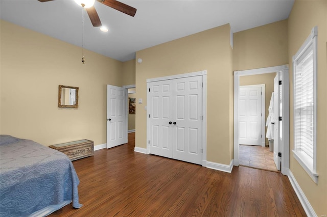 1011 N Ranney St, Sikeston, MO 63801 - bedroom with multiple windows, wood finished floors, baseboards, and a closet