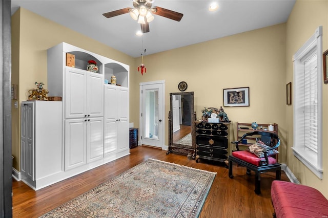 1011 N Ranney St, Sikeston, MO 63801 - living area with dark wood finished floors, ceiling fan, and baseboards