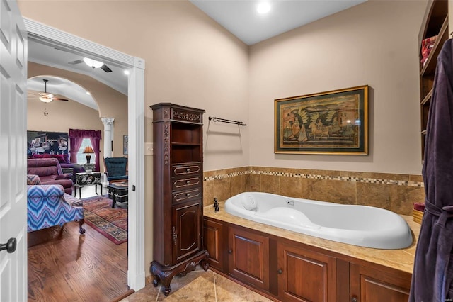 1011 N Ranney St, Sikeston, MO 63801 - ensuite bathroom featuring ornate columns, a bath, and a ceiling fan