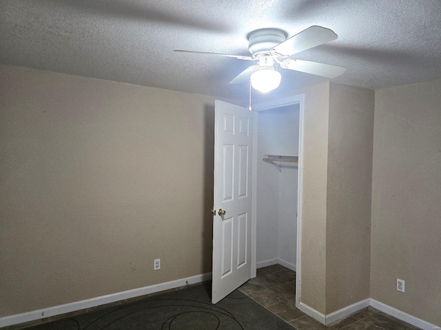 513 N E St, Poplar Bluff, MO 63901 - unfurnished bedroom with ceiling fan, a textured ceiling, a closet, and baseboards