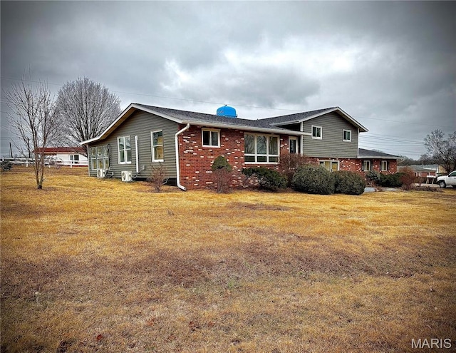 801 S Grant S, Desloge, MO 63601 - view of property exterior featuring brick siding and a yard