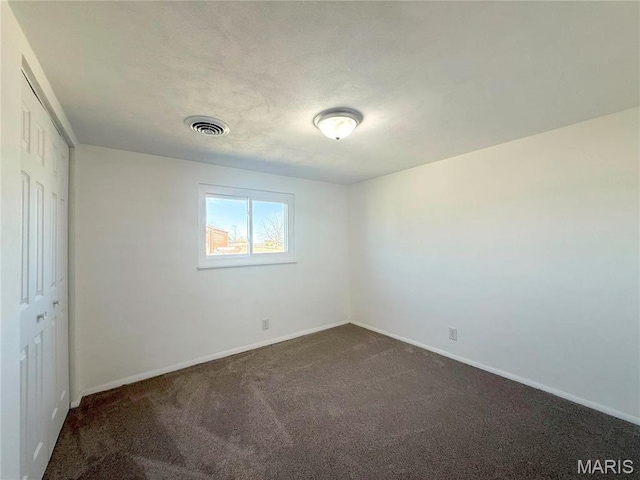 801 S Grant S, Desloge, MO 63601 - unfurnished bedroom featuring dark colored carpet, a closet, and baseboards