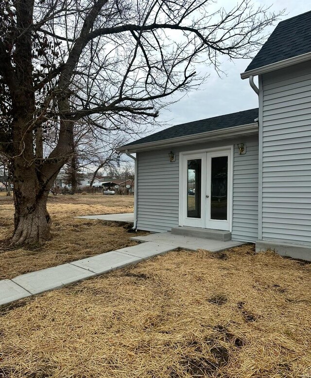 117 Pine St, Sullivan, MO 63080 - view of exterior entry with french doors and a shingled roof