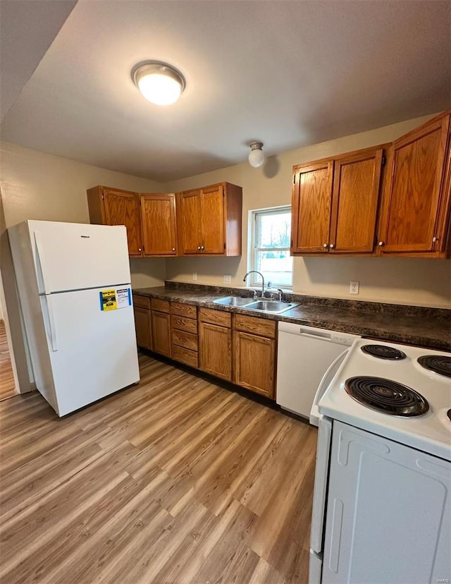 117 Pine St, Sullivan, MO 63080 - kitchen with white appliances, a sink, and brown cabinets