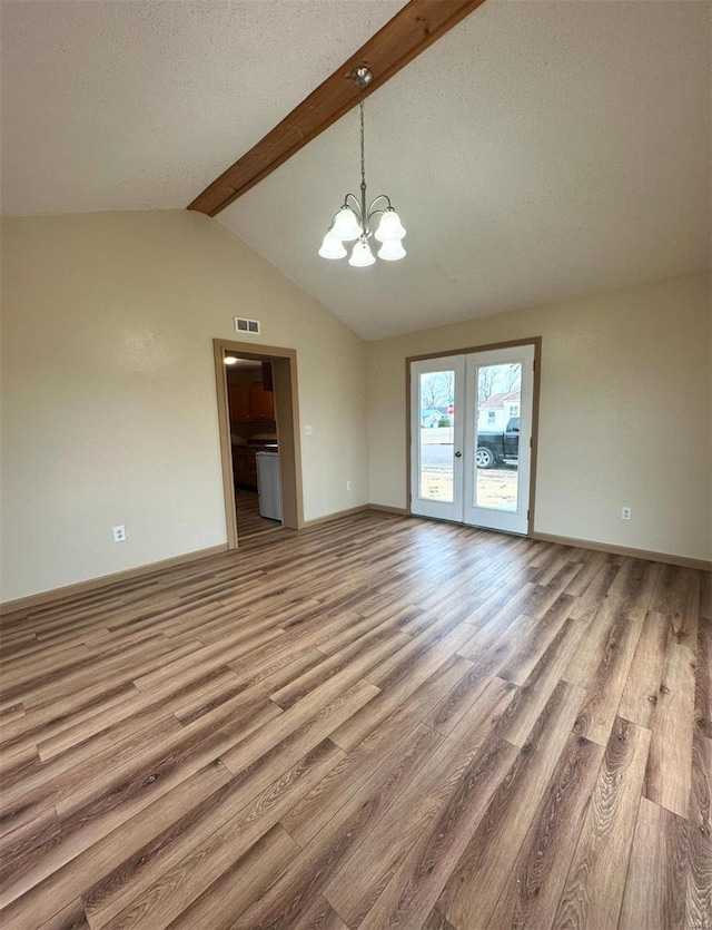 117 Pine St, Sullivan, MO 63080 - unfurnished dining area with a chandelier, wood finished floors, french doors, and baseboards