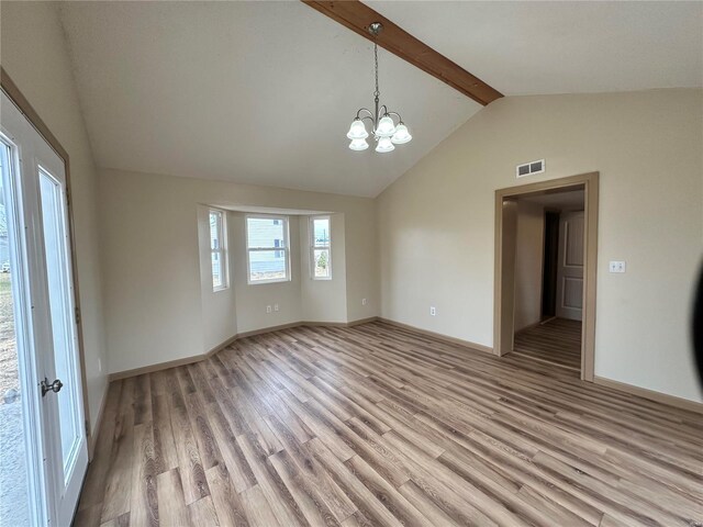 117 Pine St, Sullivan, MO 63080 - empty room with light wood finished floors, a chandelier, and baseboards