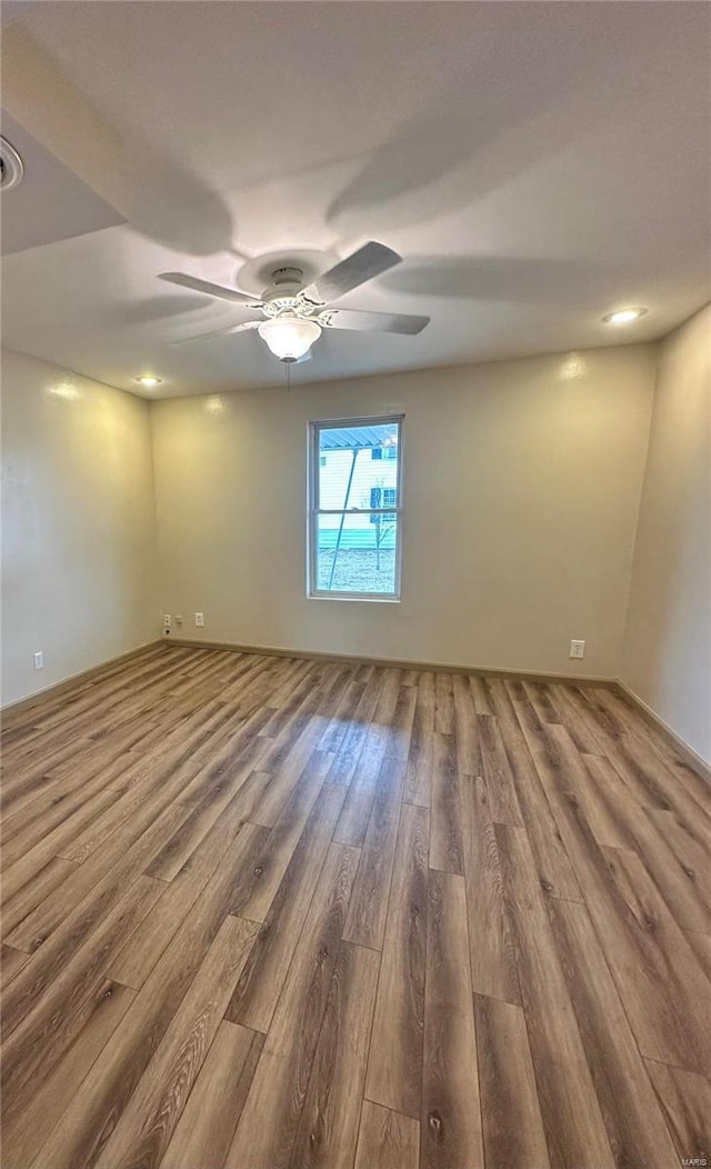 117 Pine St, Sullivan, MO 63080 - empty room with wood finished floors, ceiling fan, and recessed lighting