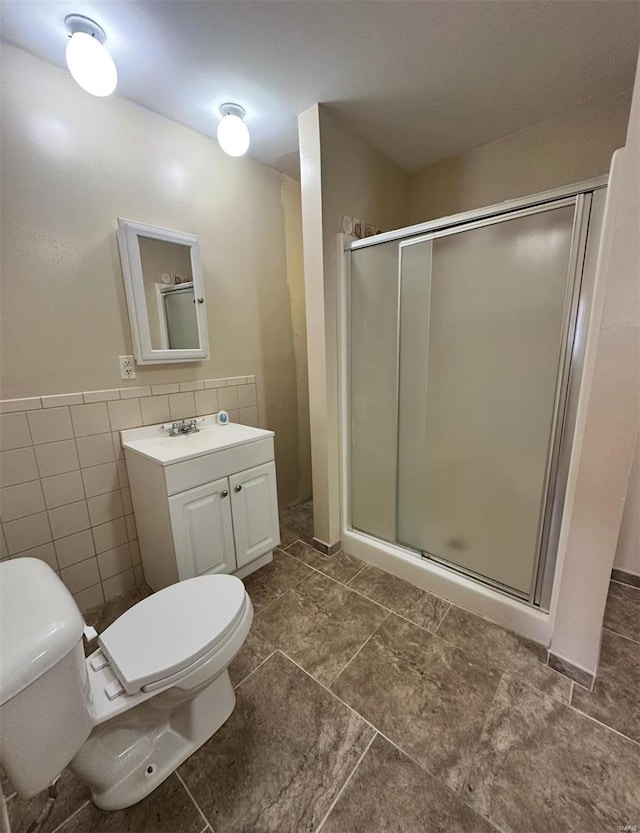 117 Pine St, Sullivan, MO 63080 - full bath featuring toilet, a stall shower, tile walls, vanity, and a wainscoted wall