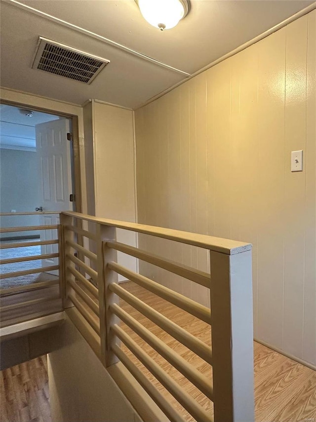 117 Pine St, Sullivan, MO 63080 - corridor featuring light wood-style flooring, an upstairs landing, and a decorative wall