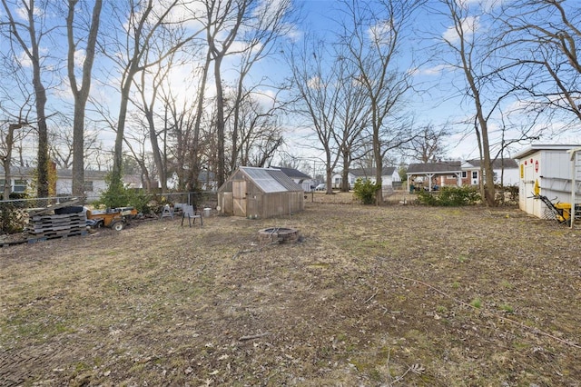 524 N St, Farmington, MO 63640 - view of yard featuring fence, an outdoor fire pit, and an outdoor structure