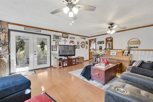 524 N St, Farmington, MO 63640 - living area featuring a textured ceiling, a ceiling fan, wood finished floors, plenty of natural light, and ornamental molding