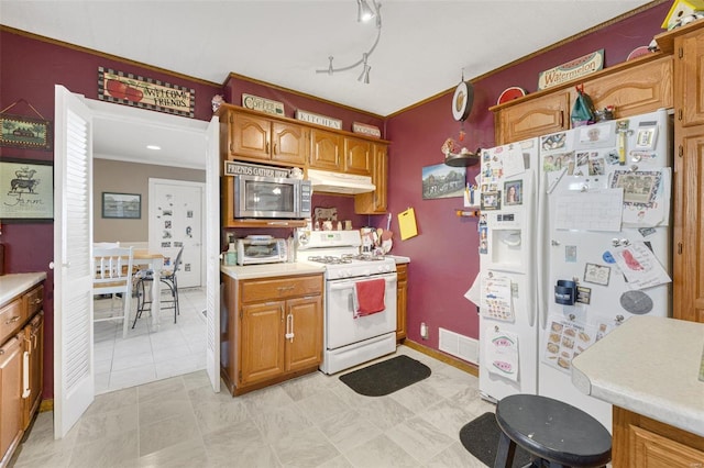 524 N St, Farmington, MO 63640 - kitchen featuring white appliances, under cabinet range hood, light countertops, brown cabinetry, and crown molding