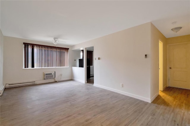7579 Hazelcrest Dr Unit A, Hazelwood, MO 63042 - empty room with wood finished floors, a wall mounted air conditioner, ceiling fan, and baseboards