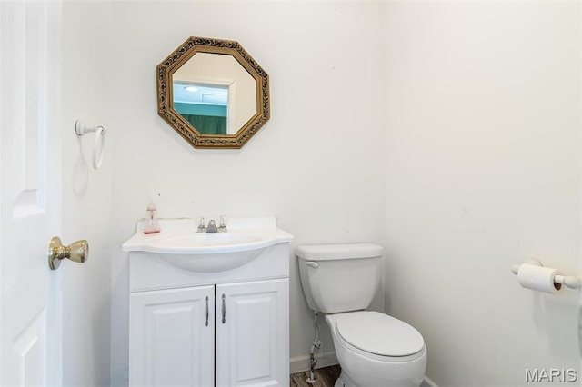 4645 Quail Run Rd, Farmington, MO 63640 - half bathroom with vanity, toilet, and baseboards