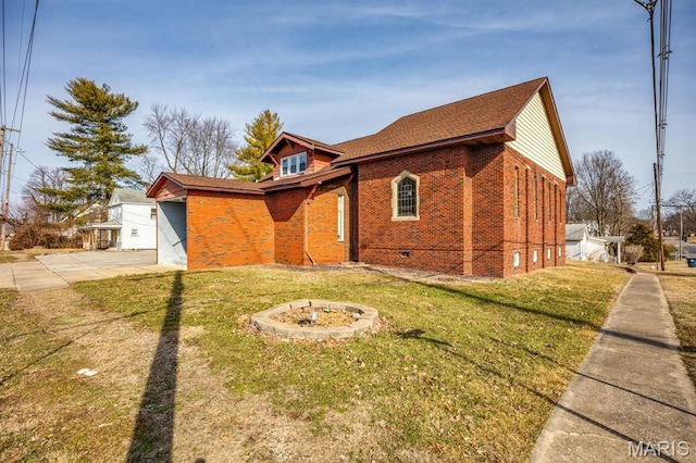 209 S Montgomery St, Gillespie, IL 62033 - view of home's exterior with brick siding, a yard, and an outdoor fire pit