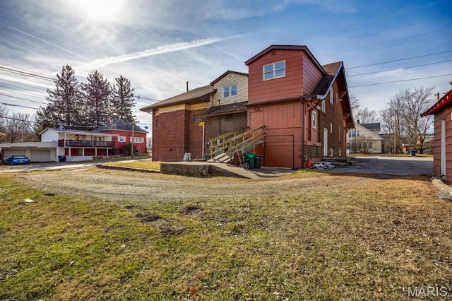 209 S Montgomery St, Gillespie, IL 62033 - back of house with brick siding and a yard