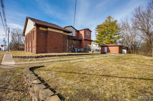 209 S Montgomery St, Gillespie, IL 62033 - back of house with brick siding, a yard, and central AC