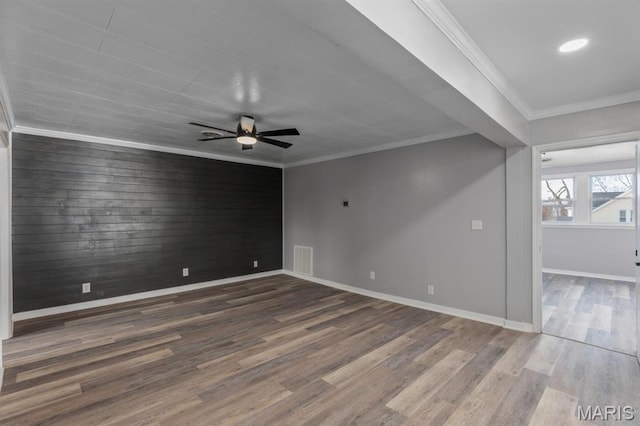 209 S Montgomery St, Gillespie, IL 62033 - unfurnished room featuring a ceiling fan, wood finished floors, baseboards, crown molding, and recessed lighting