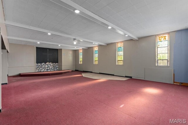209 S Montgomery St, Gillespie, IL 62033 - carpeted spare room with beamed ceiling and ceiling fan